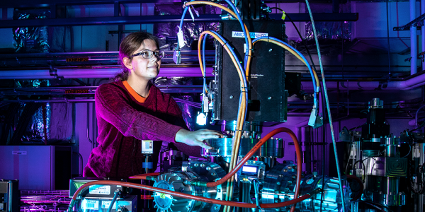 researcher working with laser instrument